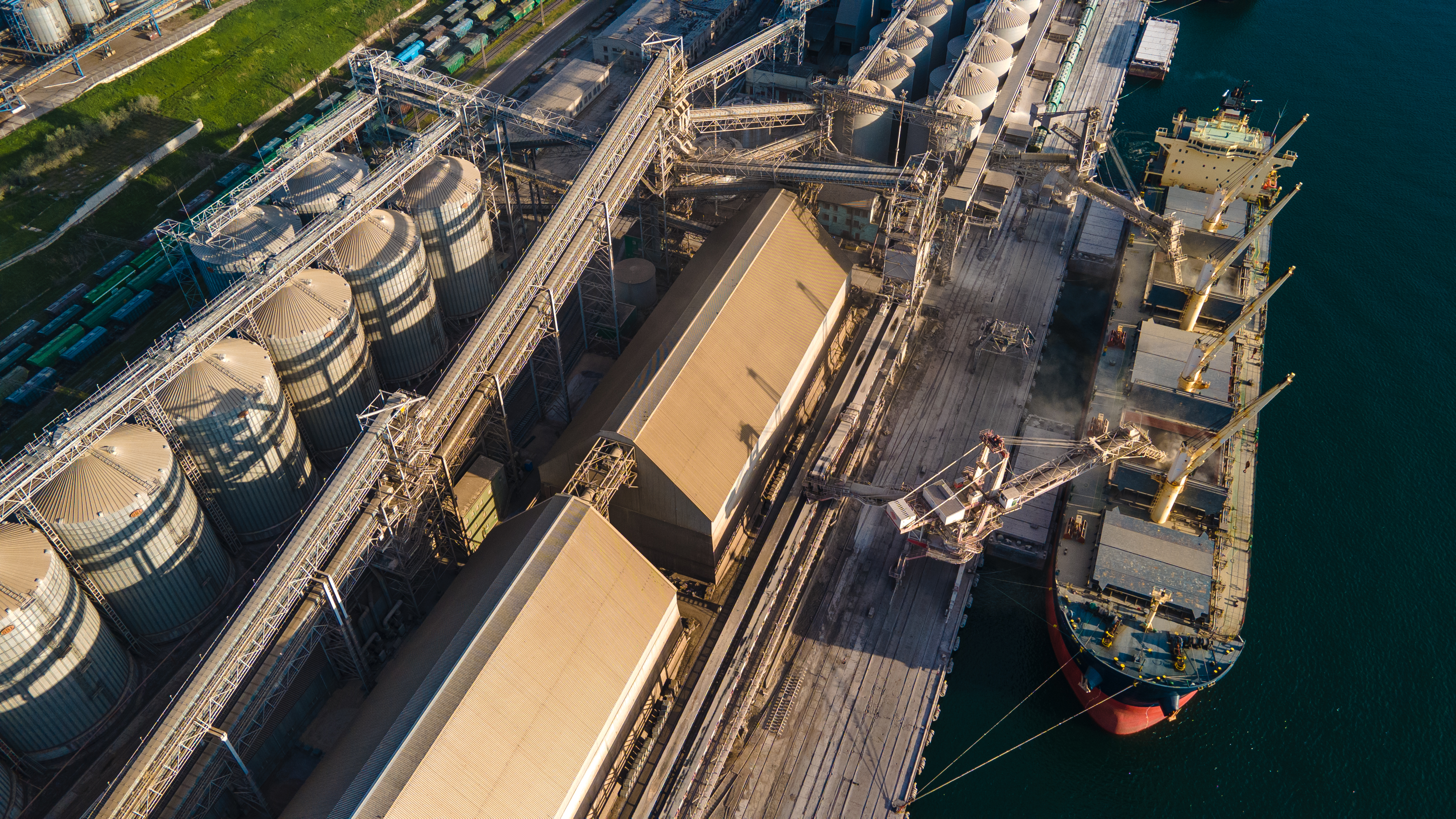 Port terminal with silos and a bulk vessel at berth